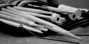picture of drumming sticks and mullets in black and white
